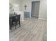 A modern dining room features laminate flooring, neutral walls, and is adjacent to the front entry at 13636 W Antelope Dr, Sun City West, AZ 85375