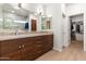 Modern bathroom with double sink vanity, granite counters, and a walk-in shower at 14010 N 12Th St, Phoenix, AZ 85022