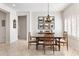 Dining room featuring a wood table set, pendant lighting and tile floors at 14010 N 12Th St, Phoenix, AZ 85022