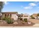 Charming single-story home with well-maintained desert landscaping and a paved driveway at 14010 N 12Th St, Phoenix, AZ 85022