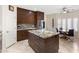 Modern kitchen with wood cabinets, granite countertops, and stainless steel appliances at 14010 N 12Th St, Phoenix, AZ 85022