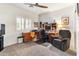 Home office featuring a ceiling fan, a large wooden desk, a chair, and natural light at 14010 N 12Th St, Phoenix, AZ 85022