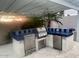 Covered outdoor kitchen featuring a built-in BBQ island and ample counter space for entertaining at 14010 N 12Th St, Phoenix, AZ 85022