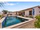 Backyard pool featuring a spa, covered patio, outdoor kitchen and mature landscaping at 14010 N 12Th St, Phoenix, AZ 85022
