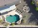 Aerial view showcases the pool, tanning deck, fire pit, and spacious backyard at 14258 W Lisbon Ln, Surprise, AZ 85379