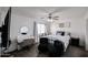 Stylish bedroom with a modern desk, charming accents, and ample natural light at 14258 W Lisbon Ln, Surprise, AZ 85379