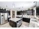 Well-equipped kitchen with granite countertops, stainless steel appliances, and a large center island at 14258 W Lisbon Ln, Surprise, AZ 85379