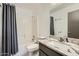 Well-lit bathroom featuring vanity with granite countertops and shower/tub combo at 14300 W Bell Rd # 307, Surprise, AZ 85374
