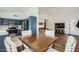 Eat-in kitchen featuring navy cabinets, stainless steel appliances, and modern finishes at 14300 W Bell Rd # 307, Surprise, AZ 85374