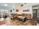 Bright living room with hard surface floors, neutral colors, and an open floor plan at 14300 W Bell Rd # 307, Surprise, AZ 85374