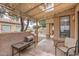 Cozy covered patio features textured walls, barbecue, and comfortable seating, perfect for outdoor dining and relaxation at 14300 W Bell Rd # 307, Surprise, AZ 85374