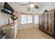 Eat-in kitchen area with a wooden cabinet, ceiling fan, and plenty of natural light at 15561 W Vista Grande Ln, Surprise, AZ 85374