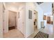 Hallway featuring decorative tile and an inspirational wall hanging with entrances to other rooms at 15561 W Vista Grande Ln, Surprise, AZ 85374