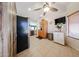 Eat-in kitchen with stainless steel appliances, tile floor, and a ceiling fan at 15561 W Vista Grande Ln, Surprise, AZ 85374