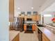Bright kitchen featuring stainless steel appliances, tile flooring, and recessed lighting at 15561 W Vista Grande Ln, Surprise, AZ 85374