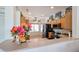 Open kitchen featuring stainless steel appliances, wood cabinets, and a breakfast bar at 15561 W Vista Grande Ln, Surprise, AZ 85374
