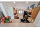Open kitchen featuring stainless steel appliances, wood cabinets, and a breakfast bar at 15561 W Vista Grande Ln, Surprise, AZ 85374
