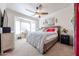 Inviting main bedroom with a ceiling fan, bay window and comfortable bed, creating a cozy and relaxing retreat at 15561 W Vista Grande Ln, Surprise, AZ 85374