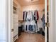 Organized walk-in closet with shelving and hanging space, providing ample storage for clothes and accessories at 15561 W Vista Grande Ln, Surprise, AZ 85374