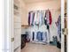 Well-organized walk-in closet with shelving and hanging rods, providing ample storage for an extensive wardrobe at 15561 W Vista Grande Ln, Surprise, AZ 85374