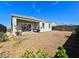 Backyard with gravel ground cover, covered patio, and low-maintenance landscaping at 18809 W Wilson St, Buckeye, AZ 85326