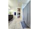 Bathroom featuring a shower with glass doors, vanity with modern fixtures, and tiled floor at 18809 W Wilson St, Buckeye, AZ 85326