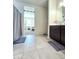 Bright bathroom featuring tile flooring, vanity with modern fixtures, and neutral color palette at 18809 W Wilson St, Buckeye, AZ 85326