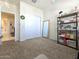 View of bedroom with closet, decorative shelving, and doorway at 18809 W Wilson St, Buckeye, AZ 85326