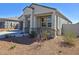 Close up of home featuring covered porch with desert landscaping at 18809 W Wilson St, Buckeye, AZ 85326