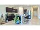Stylish kitchen with dark cabinets, granite countertops, stainless steel appliances and island with breakfast bar at 18809 W Wilson St, Buckeye, AZ 85326