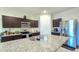 Well-equipped kitchen featuring granite countertops, stainless steel appliances, and ample cabinet space at 18809 W Wilson St, Buckeye, AZ 85326