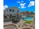 Large backyard showcases a pool, patio with outdoor seating, and well-kept landscaping at 1928 E 39Th Ave, Apache Junction, AZ 85119