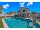 Gorgeous backyard showcasing a sparkling pool, outdoor bar, and spacious patio at 1928 E 39Th Ave, Apache Junction, AZ 85119