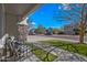Inviting front porch features stone pillars, space to sit and enjoy the neighborhood views at 1928 E 39Th Ave, Apache Junction, AZ 85119