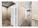 Upstairs hallway featuring carpeted floors, white doors, and ample space for storage or decor at 1928 E 39Th Ave, Apache Junction, AZ 85119