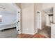 Hallway leading to a charming bedroom, showcasing the home's seamless transition and thoughtful design at 1928 E 39Th Ave, Apache Junction, AZ 85119