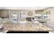 Granite counters in this kitchen offer seating, and a view of the dining room and backyard pool at 1928 E 39Th Ave, Apache Junction, AZ 85119