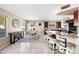 Open-concept kitchen featuring a breakfast bar with seating, dining space, and modern appliances at 1928 E 39Th Ave, Apache Junction, AZ 85119