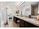 Spacious main bathroom with granite counters, double sinks, and a shower/tub combination at 1928 E 39Th Ave, Apache Junction, AZ 85119
