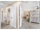 Relaxing main bedroom featuring neutral color palette, ensuite bathroom and a view from the hallway at 1928 E 39Th Ave, Apache Junction, AZ 85119