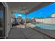 Covered patio with cozy hammock chairs overlooking the pool and backyard at 1928 E 39Th Ave, Apache Junction, AZ 85119