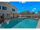 Backyard with a refreshing pool, outdoor seating, and charming string lights at 1928 E 39Th Ave, Apache Junction, AZ 85119