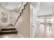 Staircase with carpeted steps and white railings, leading to the upper level of the home at 1928 E 39Th Ave, Apache Junction, AZ 85119