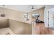 An upstairs landing with wood flooring, plenty of natural light, and space for exercise equipment at 1928 E 39Th Ave, Apache Junction, AZ 85119