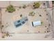 An aerial view of the property with solar panels, a shop and surrounding desert landscape at 19348 W Brave Rd, Buckeye, AZ 85326