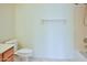 Clean bathroom featuring tile flooring, toilet and shower/tub at 19348 W Brave Rd, Buckeye, AZ 85326