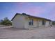 Charming single-story home with a welcoming covered porch and desert landscaping at 19348 W Brave Rd, Buckeye, AZ 85326