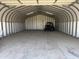 Spacious garage with ample room for vehicle storage and projects, ideal for hobbyists and car enthusiasts at 19348 W Brave Rd, Buckeye, AZ 85326