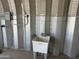 Utility sink installed in a spacious garage, great for outdoor cleanup and various household projects at 19348 W Brave Rd, Buckeye, AZ 85326