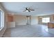 Open-concept living area with large windows, lots of natural light, and modern flooring at 19348 W Brave Rd, Buckeye, AZ 85326